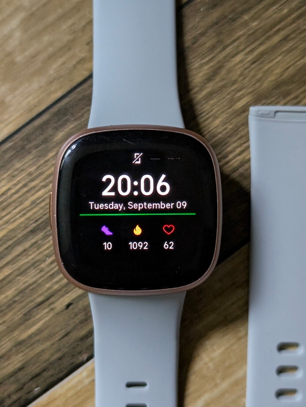 Rose Gold Frame Fitbit Versa4 with Light Blue Silicone Band